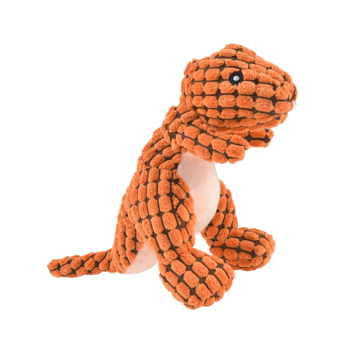 Brinquedo de pelúcia para cachorro em forma de dinossauro Tiranossauro Rex, com textura de tecido fofo na cor laranja. O brinquedo tem detalhes pretos para os olhos e uma boca branca costurada. Posicionado em pé, o dinossauro de brinquedo parece macio e é projetado para ser mordido e abraçado por pets.