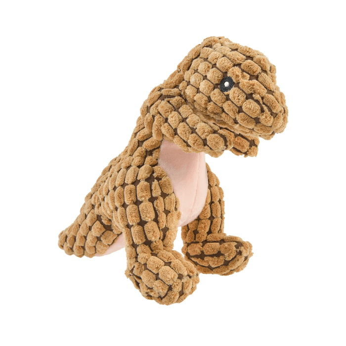 Brinquedo de pelúcia para cachorro em forma de dinossauro Tiranossauro Rex, confeccionado com tecido fofo na cor bege. O brinquedo apresenta olhos pretos bordados e uma região da barriga em cor-de-rosa claro. Sua postura é ereta e a textura do tecido proporciona uma superfície interessante para o toque, ideal para os cães brincarem e morderem.